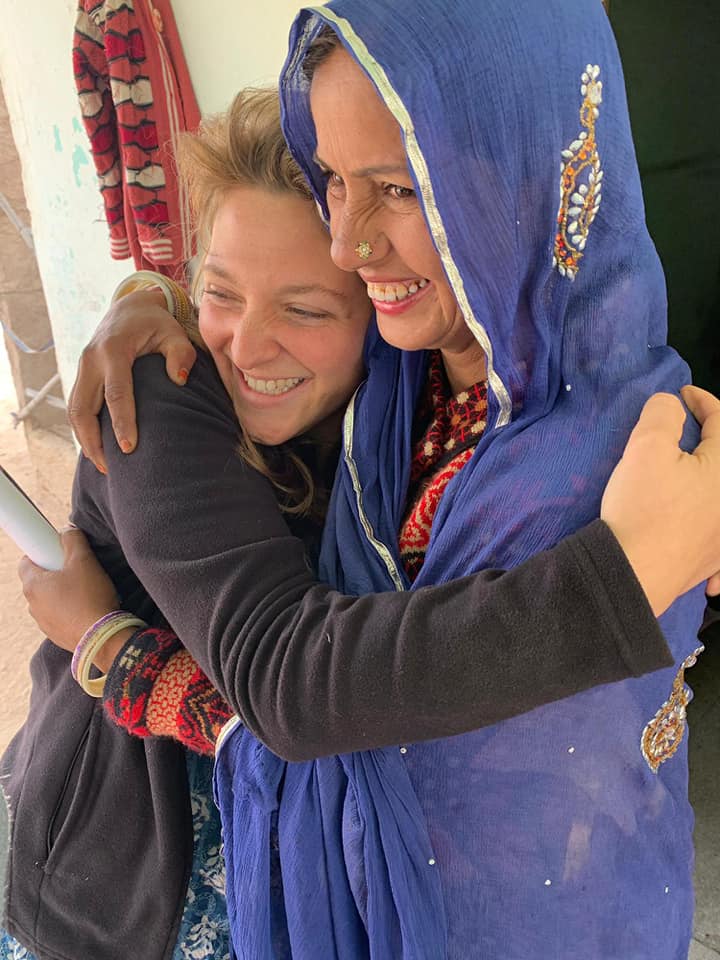 International intern embracing community member
